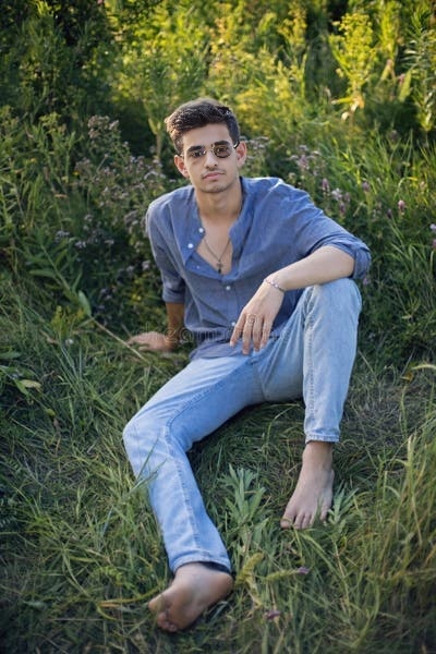 1685074910001_vtqikl_2_0-sexy-teen-guy-sunglasses-sitting-grass-nature-shirt-jeans-sexy-teen-guy-sunglasses-sitting-231383074.jpg